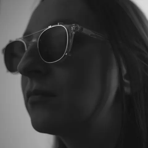 Black-and-white portrait of a woman in sunglasses